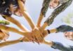 Female Teen Friends Stacking Hands Together